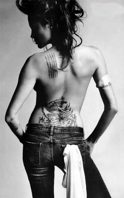  are thirteen (or more) tattoos decorating the surface of Angelina's 
